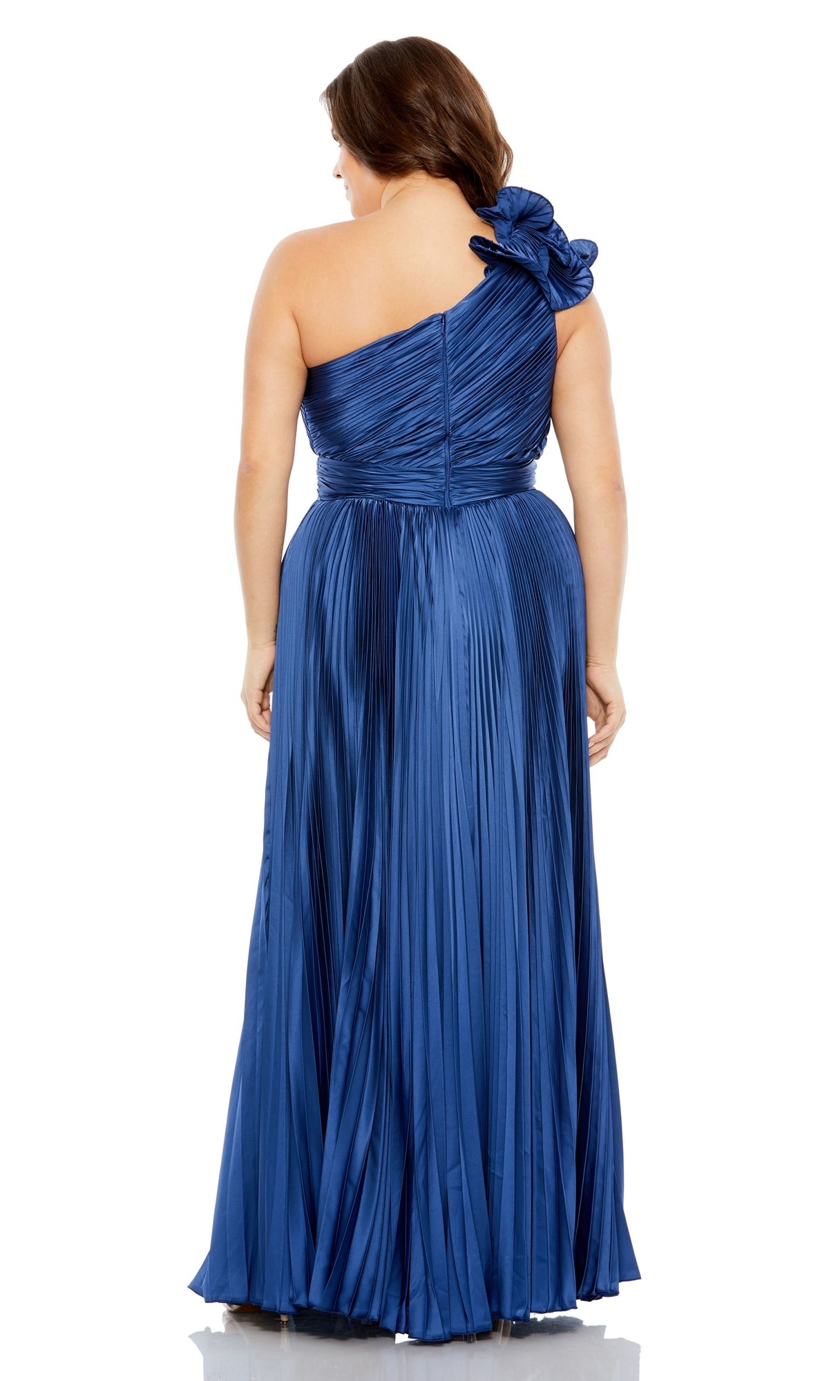A woman is shown from the back wearing the Long Plus-Size Formal Dress 77003 by Mac Duggal, a floor-length, pleated blue gown with a one-shoulder floral accent, combining timeless elegance and graceful detailing.